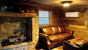 Living area - Magical Caretaker’s Cabin with Loft, Firepit, Petting Zoo & Wizarding Charm (Hayesville)