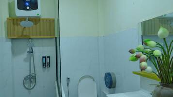 Shower, hair dryer, slippers, towels