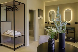 Superior Studio Suite | Bathroom | Hair dryer, towels, soap, shampoo