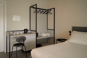 Deluxe kamer | Een minibar, verduisterende gordijnen, geluiddichte muren, gratis wifi