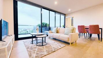 Elite Apartment, City View | Living room | 49-inch LED TV with cable channels, Netflix, streaming services