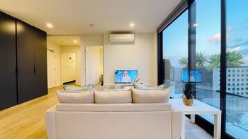 Elite Apartment, City View | Living room | 49-inch LED TV with cable channels, Netflix, streaming services