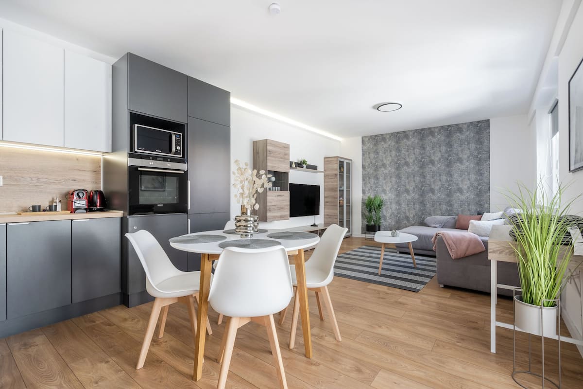 Deluxe Apartment, 1 Bedroom, Courtyard View | Living area | Flat-screen TV