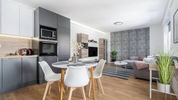 Departamento Deluxe, 1 habitación, vista al patio | Área de sala de estar