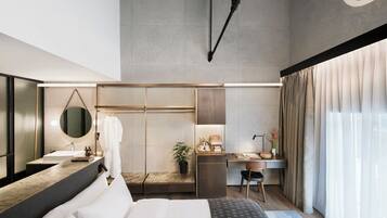 Loft, vista fiume | Minibar, cassaforte in camera, una scrivania, tende oscuranti