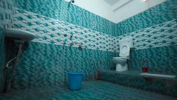 Combined shower/bathtub, towels, soap