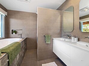 Shower, hair dryer, towels, toilet paper