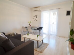 Apartment (One Bedroom Apartment with Balcony) | Living room | 32-inch flat-screen TV with satellite channels - Peaceful and Elegant Rovinj Apartment (Rovinj)
