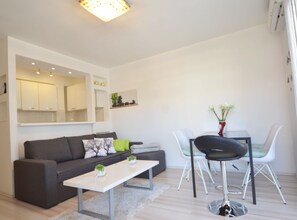 Apartment (One Bedroom Apartment with Balcony) | Living room | 32-inch flat-screen TV with satellite channels - Peaceful and Elegant Rovinj Apartment (Rovinj)
