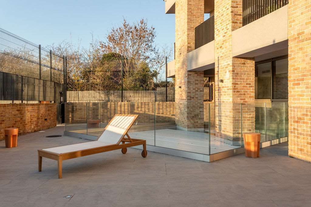 A modern building with a brick facade and large glass windows.