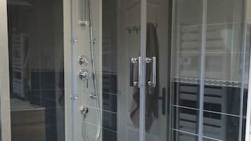 Shower, hair dryer, towels, toilet paper