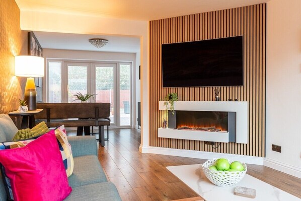 TV, fireplace, books, stereo