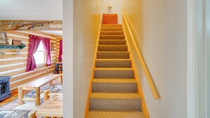 A wooden staircase with a carpeted landing and a wooden handrail. - Picnics & Bonfires: Rosedale Retreat! (Rosedale)