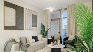 A modern living room with a sofa, a coffee table, and a large window with curtains. - 2BR w Canal & Burj View Near Dubai Mall (Dubai)