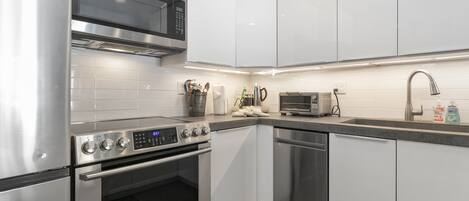 Condo, 2 Bedrooms | Private kitchen | Fridge, oven, coffee/tea maker, toaster