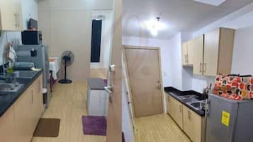 Fridge, microwave, electric kettle, cookware/dishes/utensils