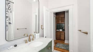 Shower, hair dryer, towels, shampoo