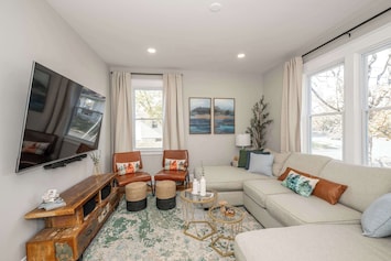 Living area with sectional seating and Smart TV