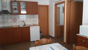 Classic Apartment, 2 Bedrooms | Living area | Flat-screen TV