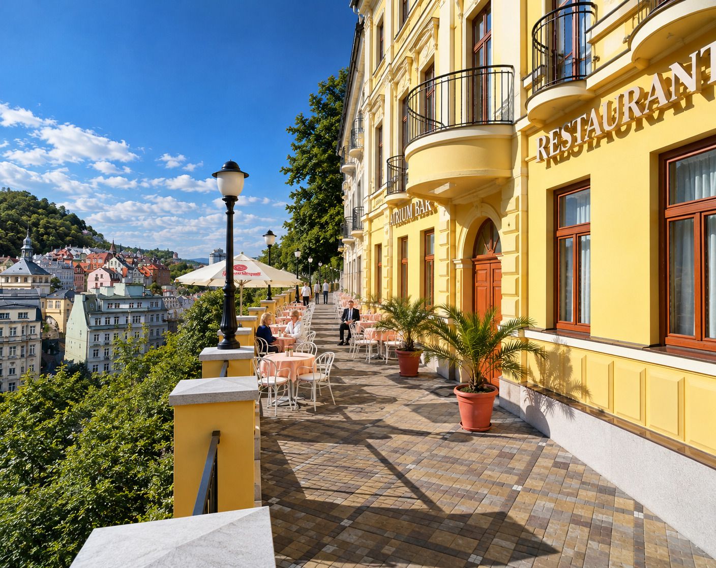A yellow building with 'RESTAURANT' signage, outdoor seating, and a view of the city.