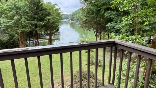 A view from a balcony overlooking a river, surrounded by trees and greenery. - Boats N Oats: Great family getaway, wifi, gentle lot, kayak (Moneta)