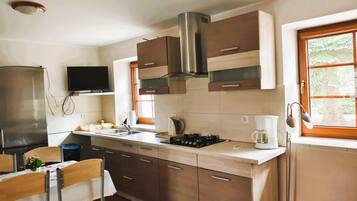 Classic Apartment, 2 Bedrooms | Private kitchen | Fridge, coffee/tea maker, electric kettle, highchair
