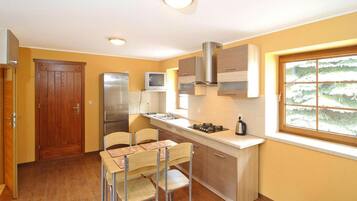 Classic Apartment, 2 Bedrooms | Private kitchen | Fridge, coffee/tea maker, electric kettle, highchair