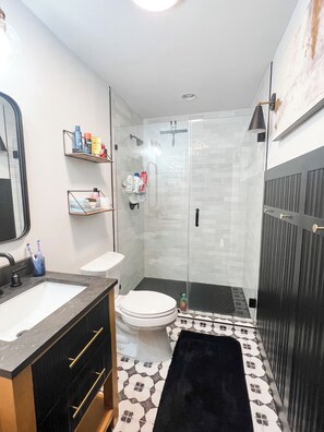 Shower, hair dryer, towels, soap