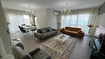 City Apartment, 2 Bedrooms, Balcony, Partial Sea View | Living area | TV