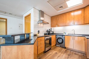 Fridge, microwave, oven, stovetop - Urban Getaway 1BR at MOG 207, Al Furjan by Deluxe Holiday Homes (Dubai)