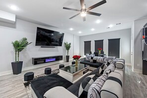 Living area - Modern Luxe 2024 Townhome w/ Indoor Hoops, Huge TVs & Near Downtown Fun (Houston)