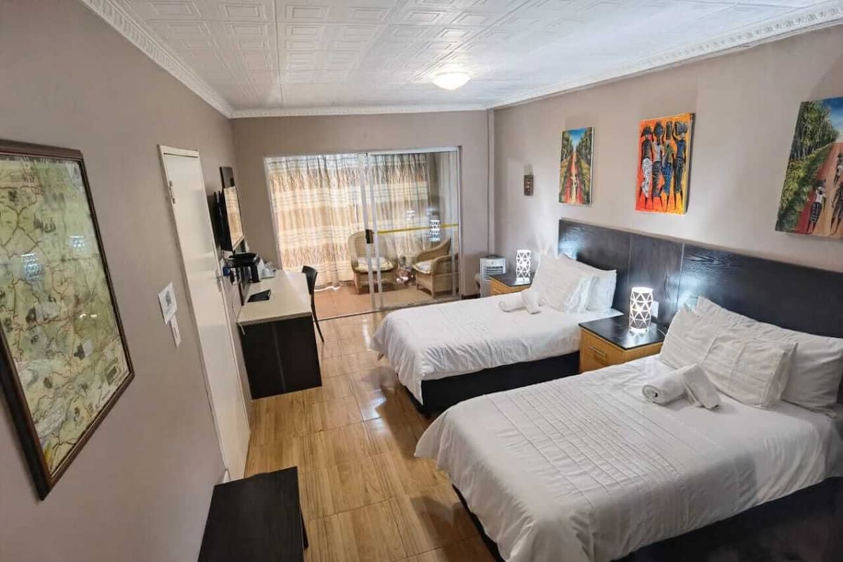 Junior Twin Room | 2 bedrooms, in-room safe, laptop workspace, iron/ironing board
