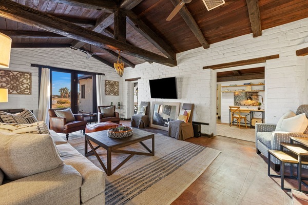 Sink into this one-of-a-kind rustic cottage surrounded by private farmland