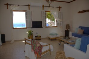 Comfort Villa, Balcony, Sea View | Living area | Flat-screen TV
