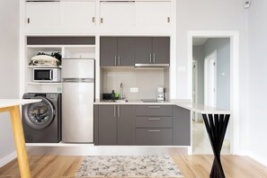 Microwave, stovetop, coffee/tea maker, cookware/dishes/utensils