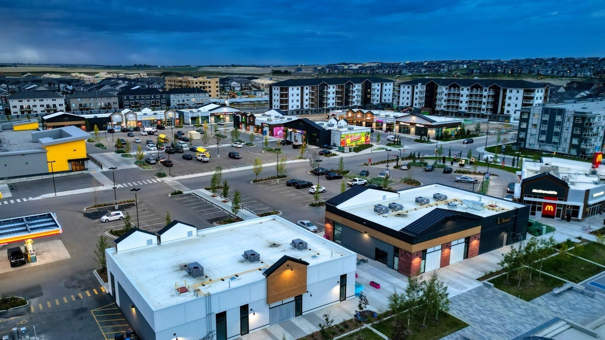 A commercial area with various buildings, including a McDonald's and a large retail store.