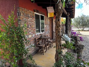 Outdoor dining - Charming 2-bedroom cabin in Valle de Guadalupe at Cerveceria Bellinghausen. (Francisco Zarco)