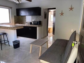 Apartment | Living area | 30-inch flat-screen TV with digital channels