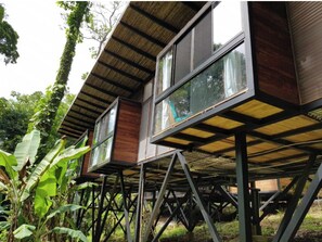 Blending seamlessly into its lush surroundings, this elevated structure offers a unique perspective.