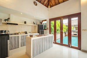 Fridge, microwave, stovetop, coffee/tea maker