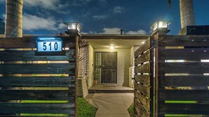 A gated entrance with a number sign '510' and a pathway leading to a building. - San Diego City Escape – Perfect for Families, Groups, & Business Travelers (San Diego)