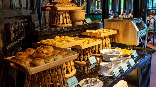 A buffet with various baked goods and hot beverages. - Nature Resort Hoi An (Da Nang)