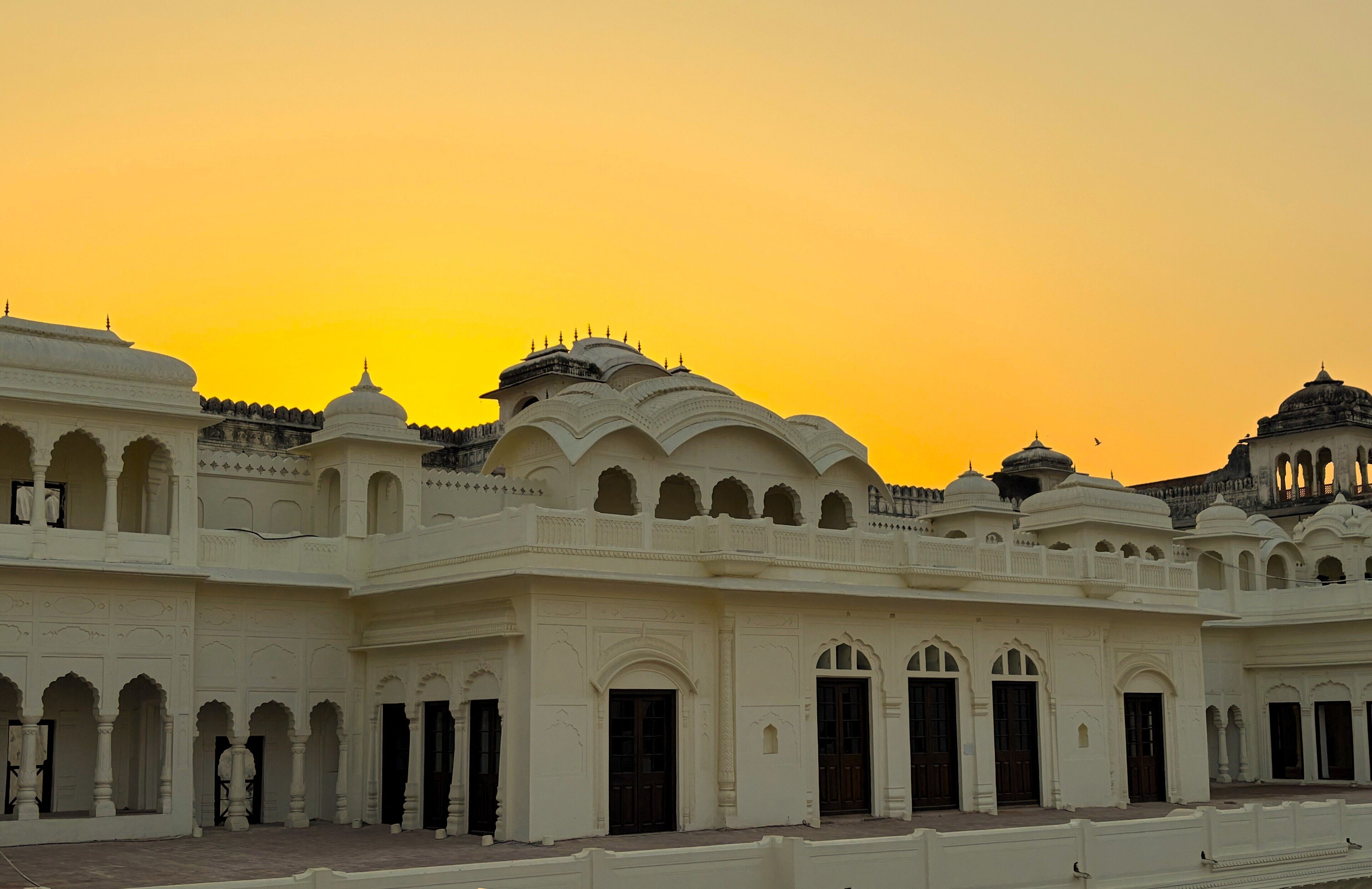 A historic building with multiple domes and arches, featuring intricate architectural details.