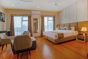 Family Room, 1 King Bed, City View | Living area - Pax Hotel AK Continental (Dera Bassi)