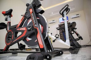 Stay active with our fitness center's state-of-the-art exercise equipment, including a stationary bike.