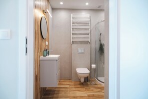 Shower, towels, soap, toilet paper