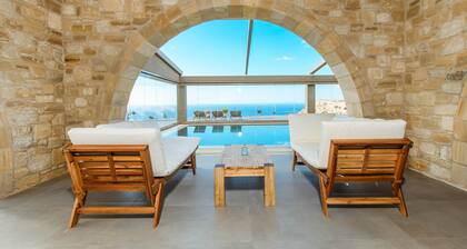 Villa Kalithea, with indoor heating pool, unlimited sunset views to the ocean.