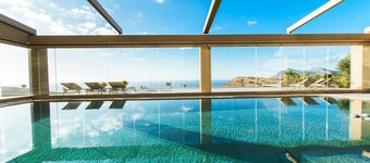 Villa Kalithea, with indoor heating pool, unlimited sunset views to the ocean.