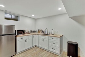 Fridge, microwave, stovetop, coffee/tea maker