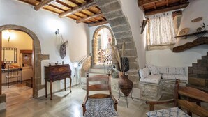 A rustic interior with stone walls, wooden furniture, and a vaulted ceiling. - Villa Anta With 2 Bedrooms and 1 Bathrooms (Rethymno)